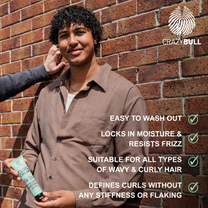 Man holding C4 Curl Cream with text about hair care features against a brick wall, featuring the Crazy Bull brand.