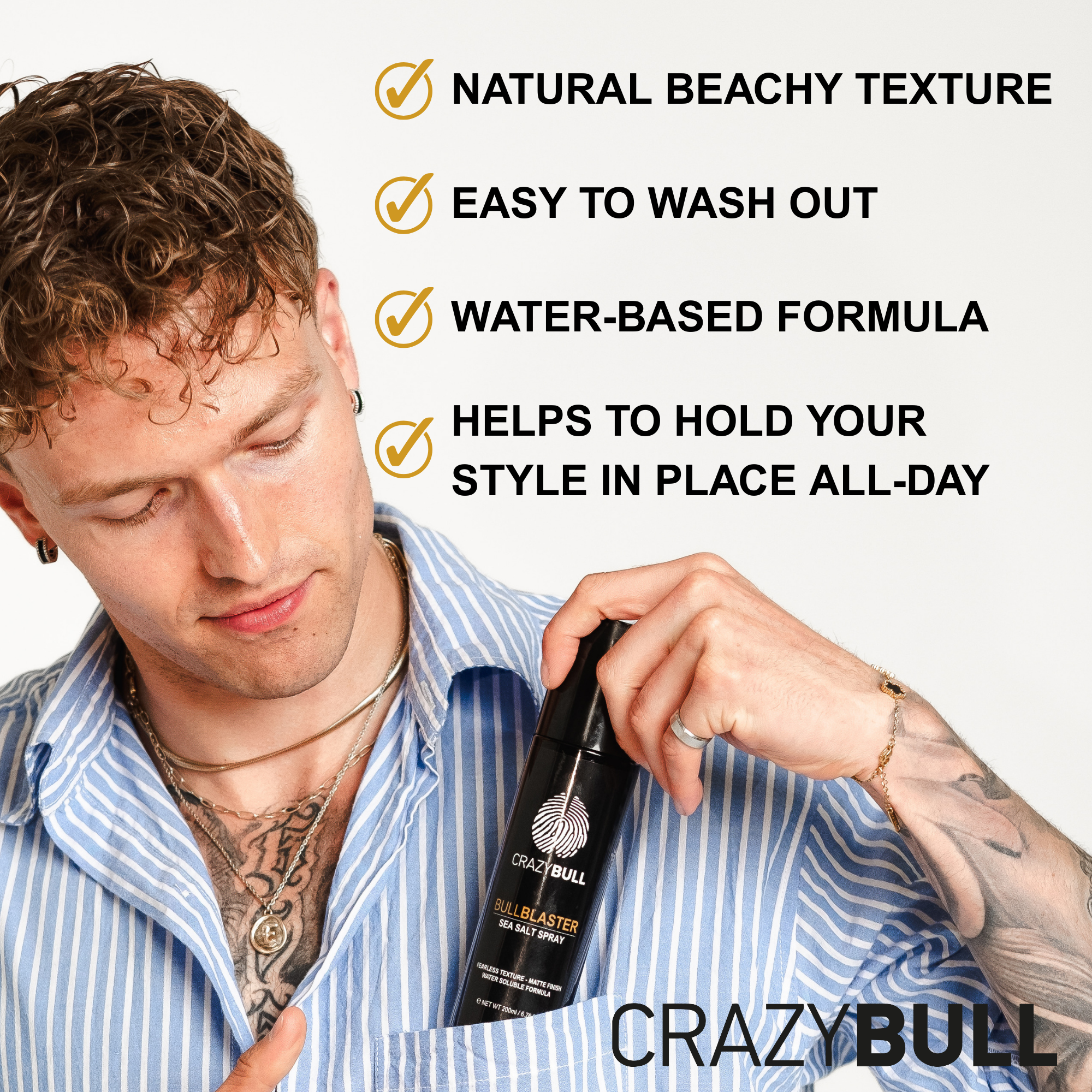 Person holding Crazy Bull Bull Blaster Salt Spray with text about hair care benefits on a gray background